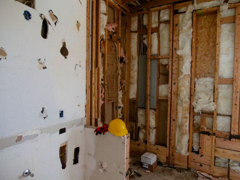 Interior room stripped down to the studs during a demolition clean-out